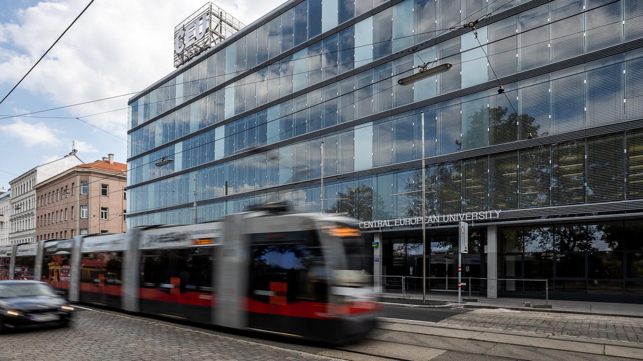 Blurry image of Vienna tram going by CEU campus.