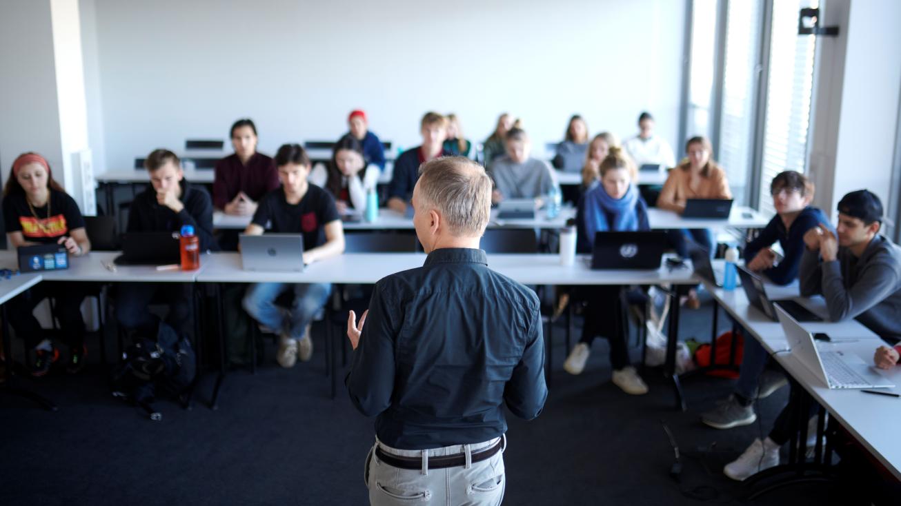 students in classroom with professor
